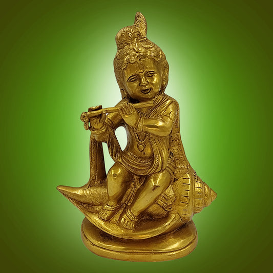 Brass Krishna Seated on Shankh, Flute in Hand, Golden Finish - SvarupArt